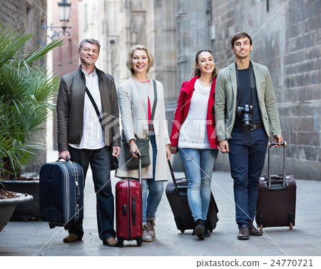 Portrait of young and mature couple with baggage 24770721