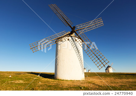 Group of windmills in sunny day time Group of windmills in sunny day time 24770940