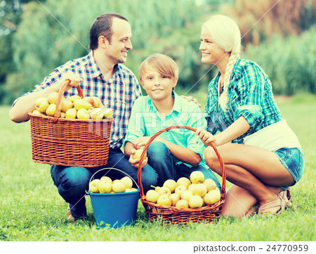 young family in the village 24770959