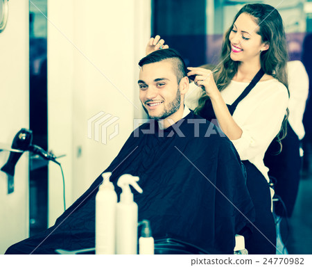 Hairdresser doing hairstyle Hairdresser doing hairstyle 24770982