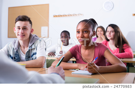 Pupils at the lesson in the school. Pupils at the lesson in the school. 24770983