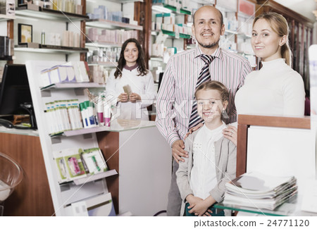 Family in the pharmacy 24771120