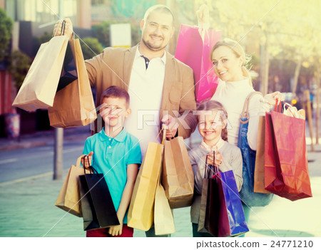 family happily shopping together family happily shopping together 24771210