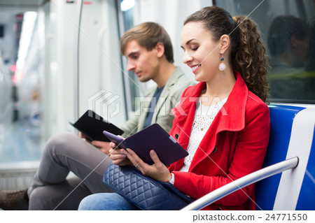 Smiling people reading smartphone and e-book 24771550