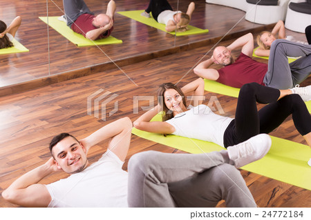 Adults having group fitness class 24772184