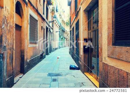 Old narrow street of european city. Barcelona 24772381