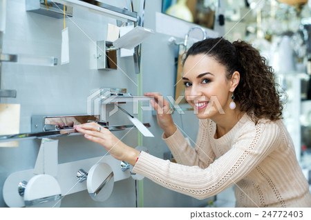 Female customer buying interior lights for home Female customer buying interior lights for home 24772403