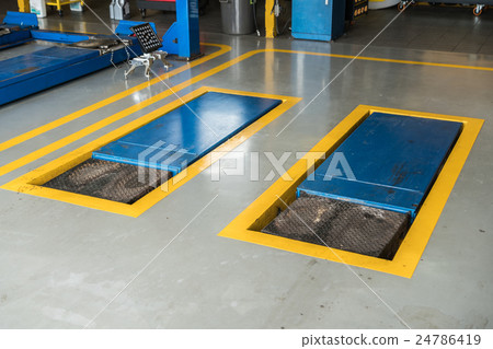jacks, scissor cranes lift the car in garage jacks, scissor cranes lift the car in garage 24786419