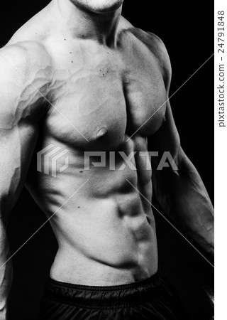 Muscular sexy torso of young sporty man with 24791848