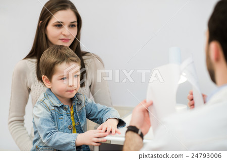 Little boy with mum on control pediatric visit at Little boy with mum on control pediatric visit at 24793006