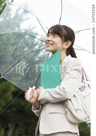 Business woman in business that marks an umbrella 24793584