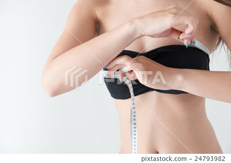 Woman measuring bust · white back 24793982