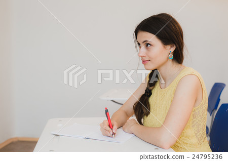 Female Teenage Student Studying In Classroom Female Teenage Student Studying In Classroom 24795236