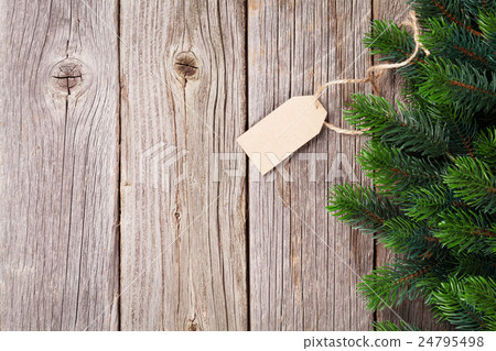 Christmas wooden background with fir tree Christmas wooden background with fir tree 24795498