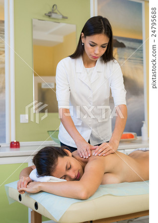 Pretty Woman enjoying shoulder massage at beauty Pretty Woman enjoying shoulder massage at beauty 24795688
