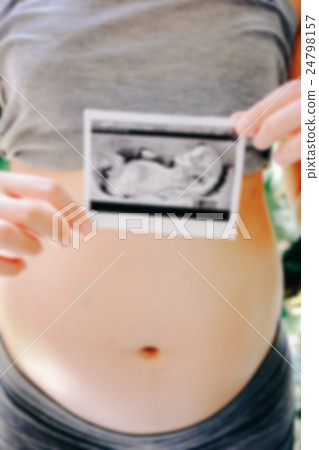 Pregnant Woman Holding Ultrasound Scan Photo Pregnant Woman Holding Ultrasound Scan Photo 24798157