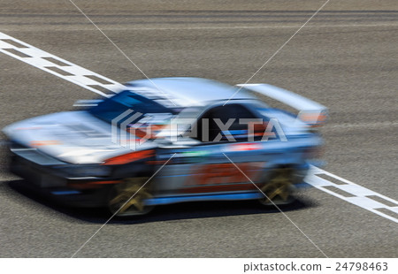 Race car racing on speed track with motion blur cr 24798463