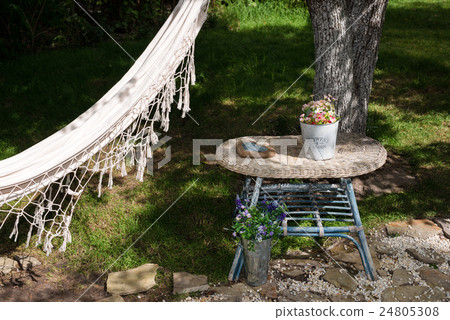 Hammock in the summer garden, sunny day. Selective Hammock in the summer garden, sunny day. Selective 24805308