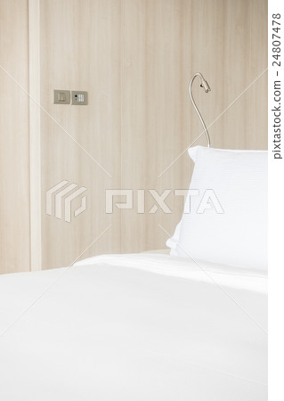 White pillow on bed 24807478
