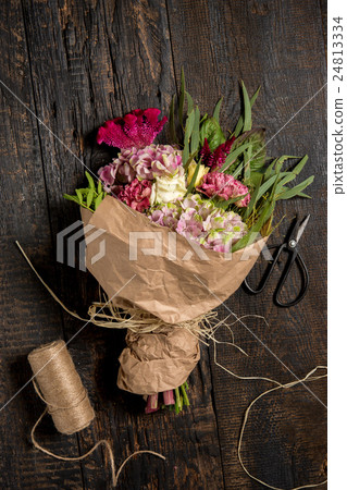 The flowers on wooden background 24813334