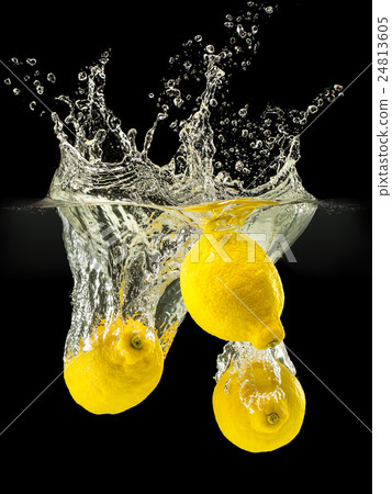 Group of fresh fruits falling in water on black 24813605