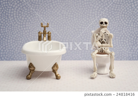 Skeleton Sitting On Water Closet While Thinking Stock Photo