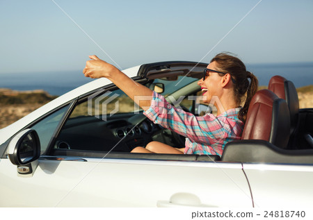 Young woman in sunglasses making self portrait Young woman in sunglasses making self portrait 24818740