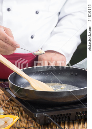 Chef putting minced garlic for cooking Pad Thai Chef putting minced garlic for cooking Pad Thai 24819133