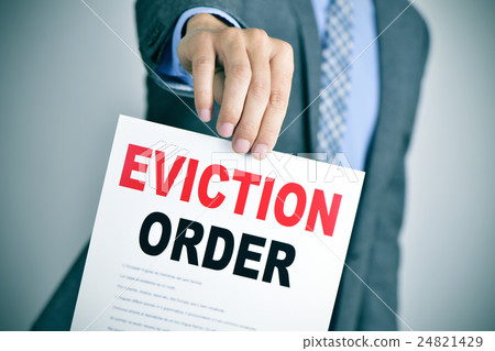 man in suit with an eviction order 24821429
