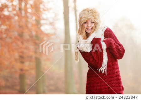 Portrait of pretty smiling woman in fur winter hat Portrait of pretty smiling woman in fur winter hat 24822847