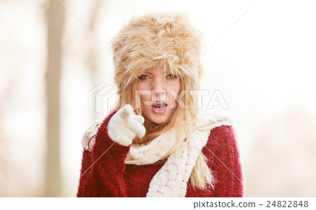 Angry pretty fashion woman in fur winter hat Angry pretty fashion woman in fur winter hat 24822848