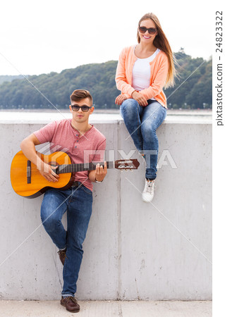 Girl listening to serenade. 24823322