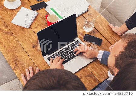 Business people team together look at laptop in Business people team together look at laptop in 24823710