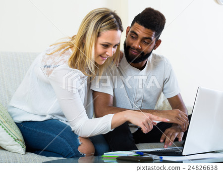 Couple browsing web at home. 24826638