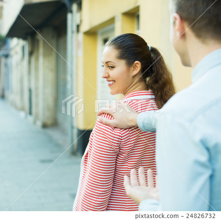 Girl flirting with hadsome guy 24826732