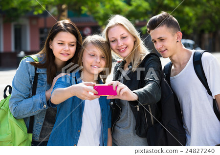Teenagers doing selfie outdoors 24827240