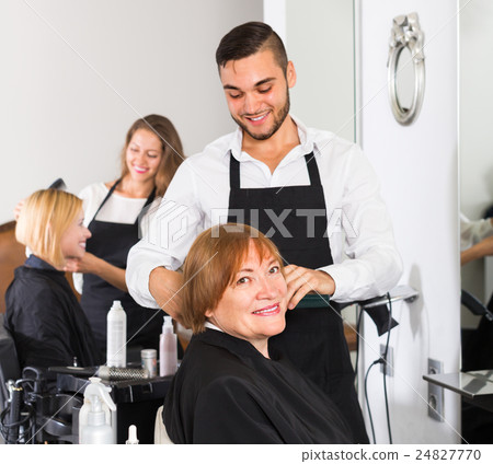 Mature woman in the barbershop. 24827770