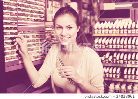 Portrait of young woman choosing pencils for drawing Portrait of young woman choosing pencils for drawing 24828061