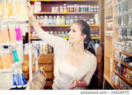 woman choosing paint color in tube woman choosing paint color in tube 24828073