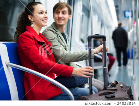 Couple with baggage in car Couple with baggage in car 24828814