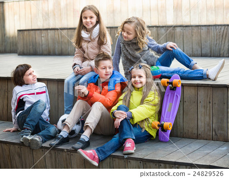 Group of children portrait with ball and skateboard 24829526