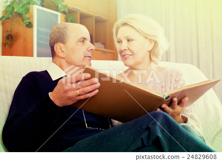 Pensioners watching old photoes Pensioners watching old photoes 24829608