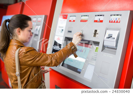 Woman buying ticket at subway 24830040