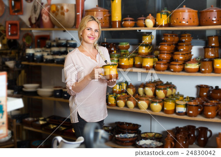 customer picking crockery 24830042