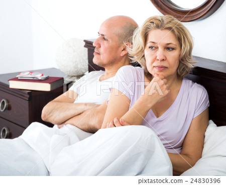 Mature couple quarrels in bed 24830396