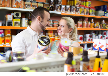 Couple discussing and selecting paint 24830485