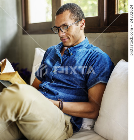 Attractive Young Man Reading Concept 24832624