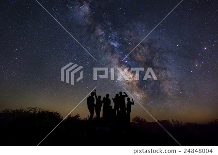 A Man is standing next to the milky way galaxy A Man is standing next to the milky way galaxy 24848004