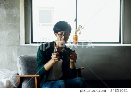 A man with a camera A man with a camera 24851081