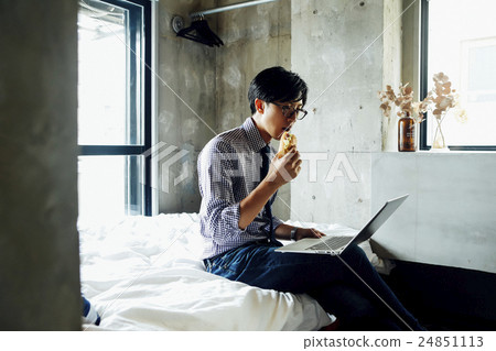 Men sitting on bed 24851113